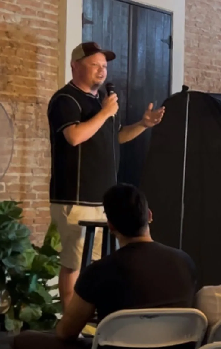 Walt Karr performs stand-up comedy during a show in Oxford, Mississippi.
