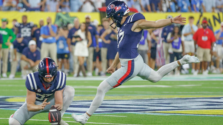 Ole Miss Rebels kicker Lucas Carneiro (17) kicks the game-winning field goal from the hold of Mississippi Rebels punter Oscar Bird (33) during the Music City Kickoff against the Louisville Cardinals
