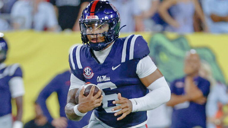 Ole Miss Rebels quarterback Trinidad Chambliss (6) runs with the ball at midfield during the Music City Kickoff against the Louisville Cardinals
