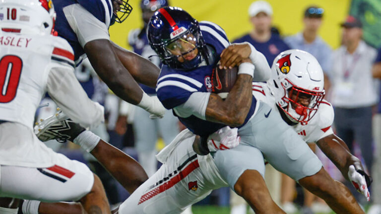 Ole Miss Rebels quarterback Trinidad Chambliss (6) dives for a first down during the Music City Kickoff against the Louisville Cardinals