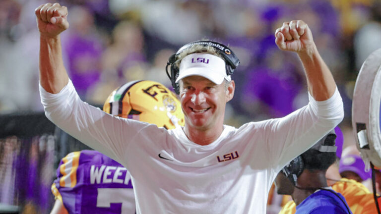 LSU Tigers coach Lane Kiffin celebrates on the sideline following a turnover during the second half of a game against the Louisiana Tech Bulldogs at Tiger Stadium