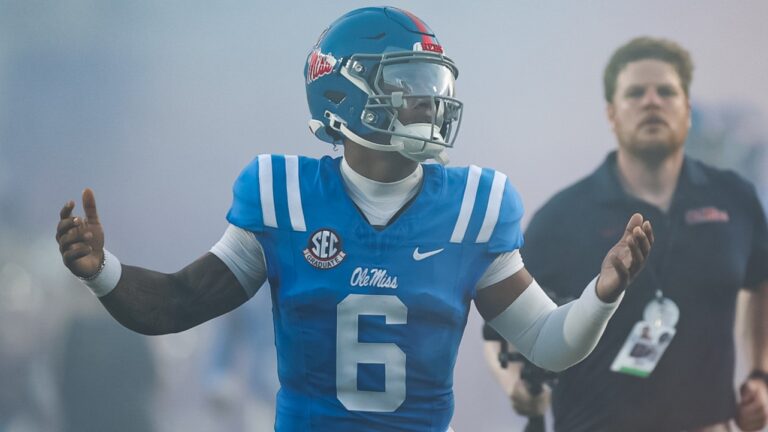 Ole Miss quarterback Trinidad Chambliss runs onto the field ahead of a game against No. 7 LSU. | Ole Miss Athletics