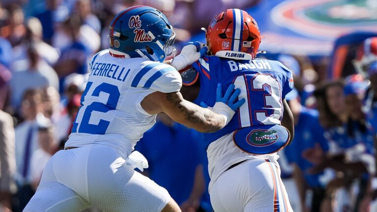 Florida running back Jadan Baugh escapes a tackle by Luke Ferrelli in the Gators' win in Gainesville, Fla. | Ole Miss Athletics