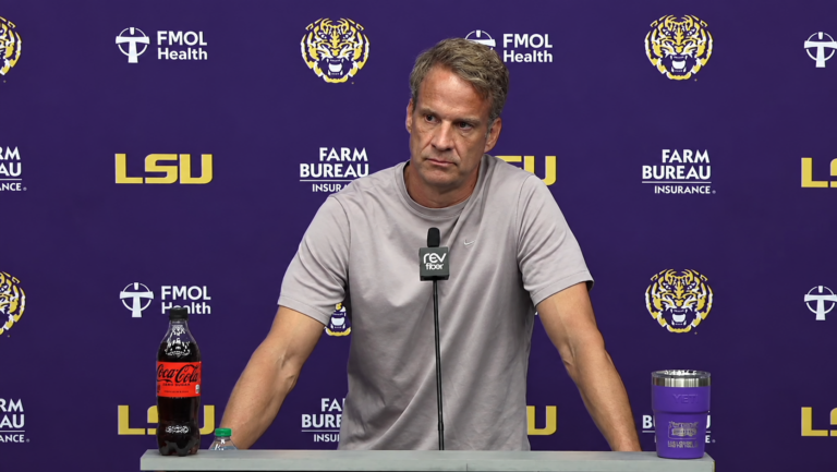 Ole Miss coach Lane Kiffin listens to a question during his Monday press conference ahead of facing his former team. | LSU Sports/YouTube