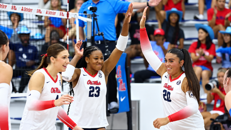 Ole Miss' Jorda Cook (23) and Vivianna Samaniego (20) high five after the Rebels win a point Tuesday against Clemson. | Ole Miss Athletics