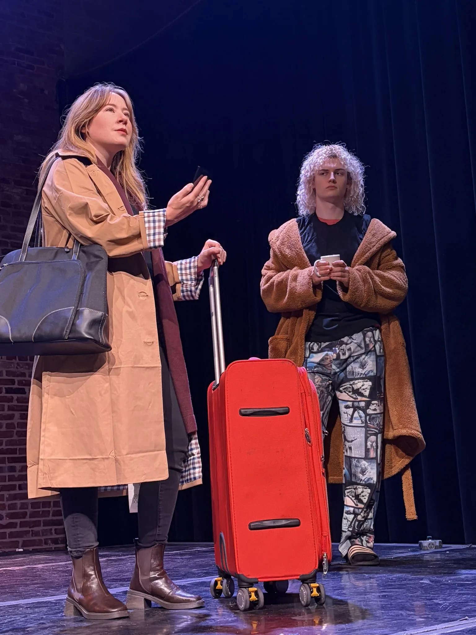 Sarah Odom and Billy Atkins perform a scene with a suitcase in Theatre Oxford’s “Almost, Maine.”