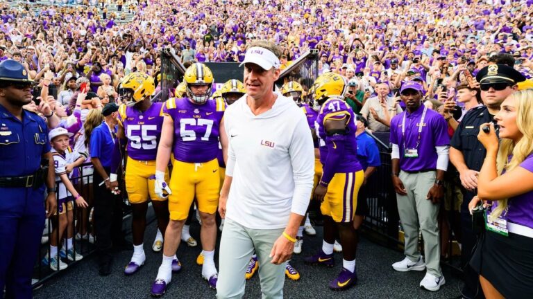 LSU coach Lane Kiffin leads the Tigers out of the tunnel against Louisiana Tech. | LSU Athletics