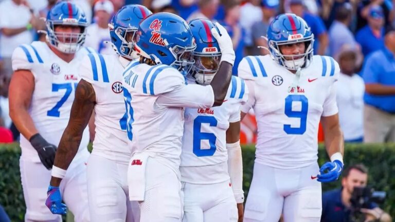 Ole Miss quarterback Trinidad Chambliss celebrates a rushing touchdown with teammates against Florida. | Ole Miss Athletics