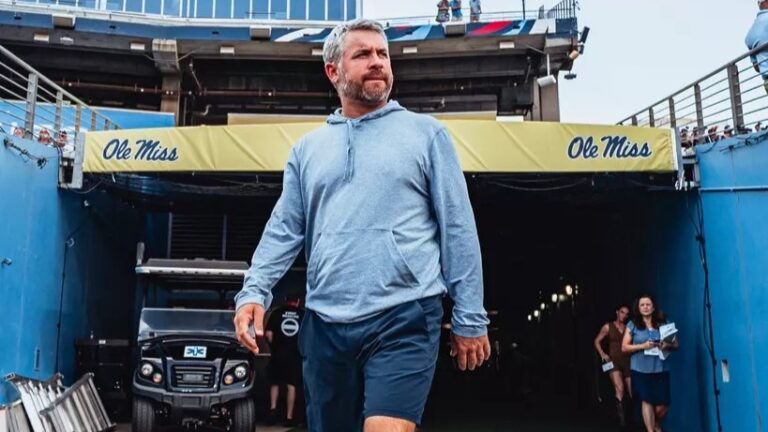 Ole Miss coach Pete Golding walks onto the field at Nissan Stadium in Nashville ahead of the team's season-opening game against Louisville. | Ole Miss Athletics