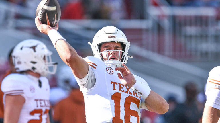 Texas Longhorns quarterback Arch Manning in warmups before game against the Arkansas Razorbacks at Razorback Stadium