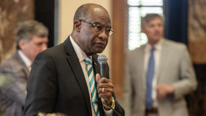 Sen. Johnny DuPree speaks into a microphone on the Mississippi Senate floor.