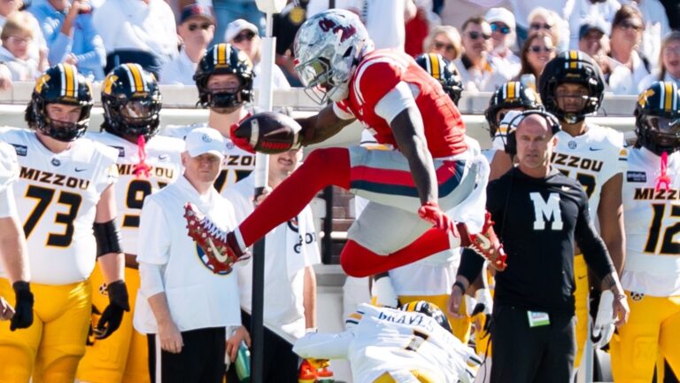 Ole Miss running back Kewan Lacy hurdles over a Missouri defender in the Rebels' 31-3 win. | Ole Miss Athletics/X