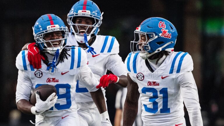 Ole Miss defensive back Nick Cull celebrates his interception against Vanderbilt with Ladarian Clardy (31) and Antonio Kite. | Ole Miss Athletics