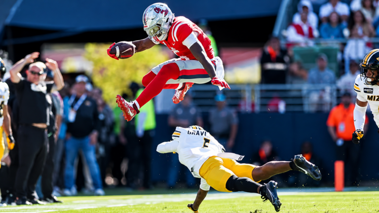 Ole Miss running back Kewan Lacy hurdles over a Missouri defender in the Rebels' 31-3 win. | Ole Miss Athletics