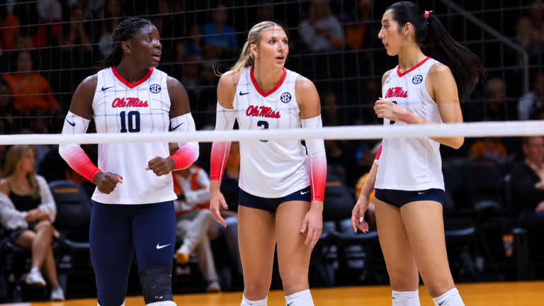 Ole Miss' Nina Moorer, Sophie Taylor and Tenesyn Frye talk during Friday's match against Tennessee. | Ole Miss Athletics