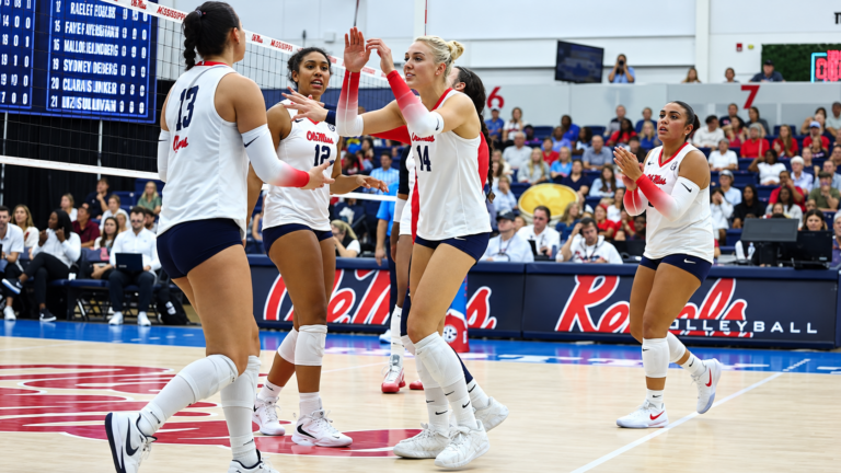 Ole Miss volleyball players celebrate a point won in a home matchup against Vanderbilt. | Ole Miss Athletics